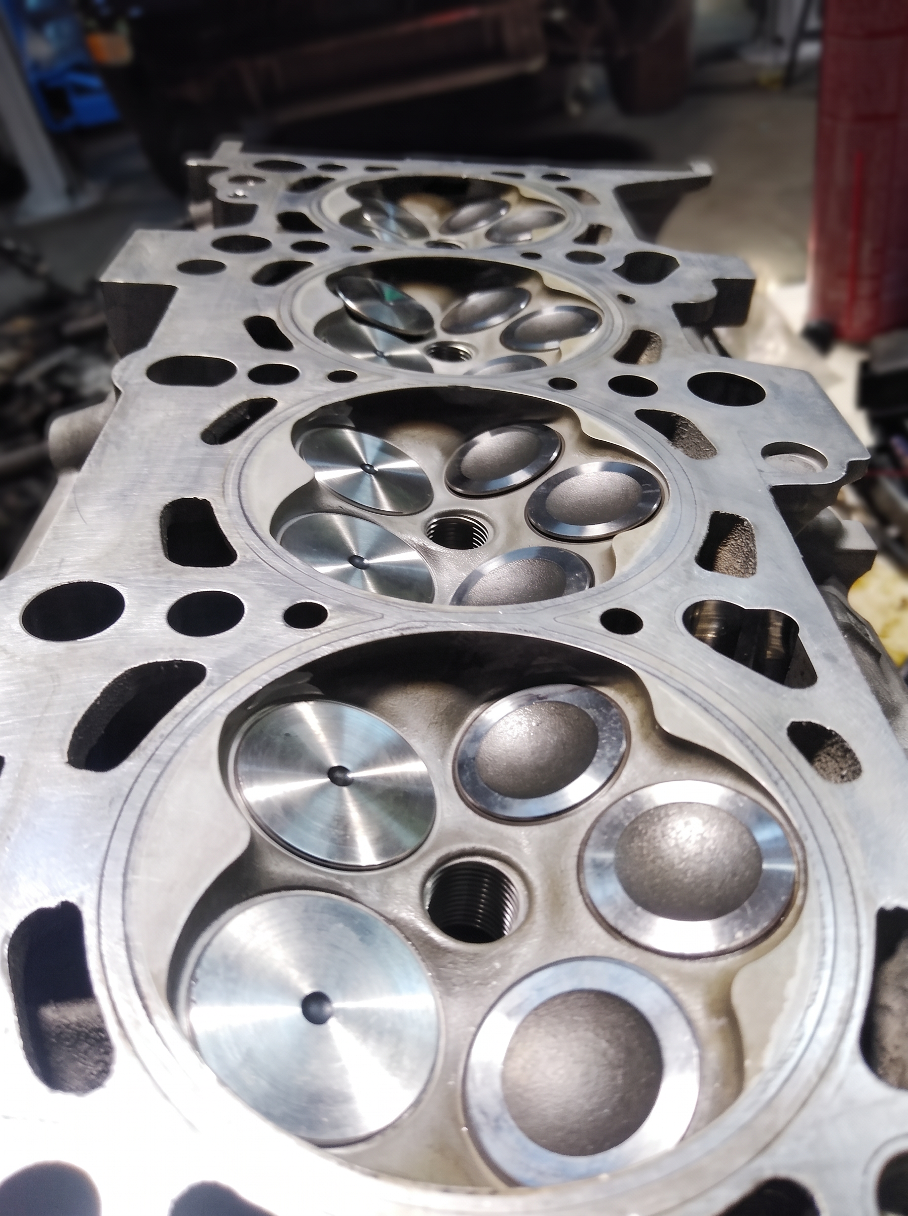 Freshly machined aluminum cylinder head with polished combustion chambers