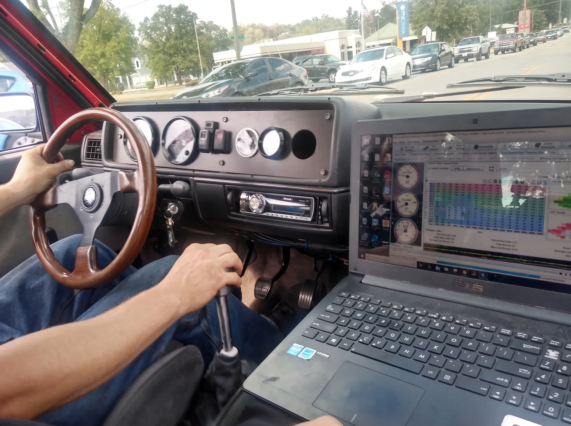 Street tuning session with a laptop logging data from the passenger seat