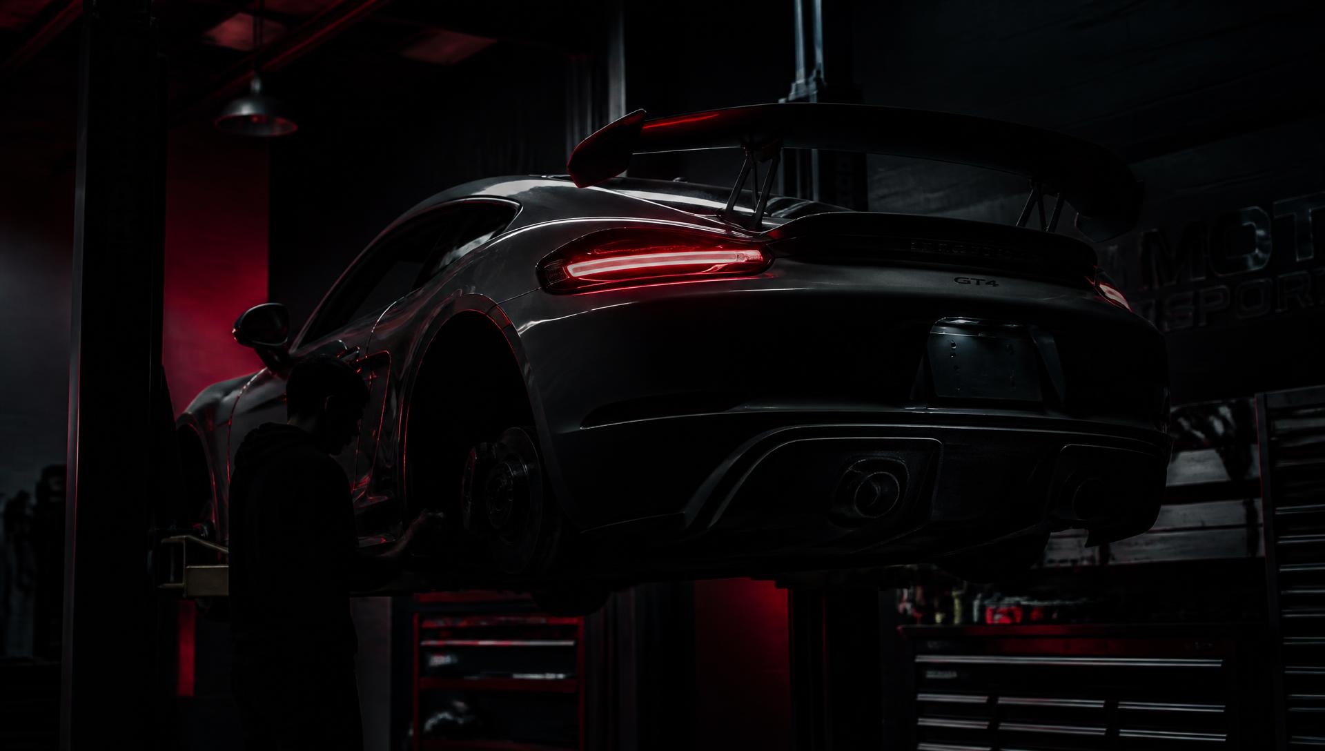 Sports car on a lift inside the Track Days Tuning shop